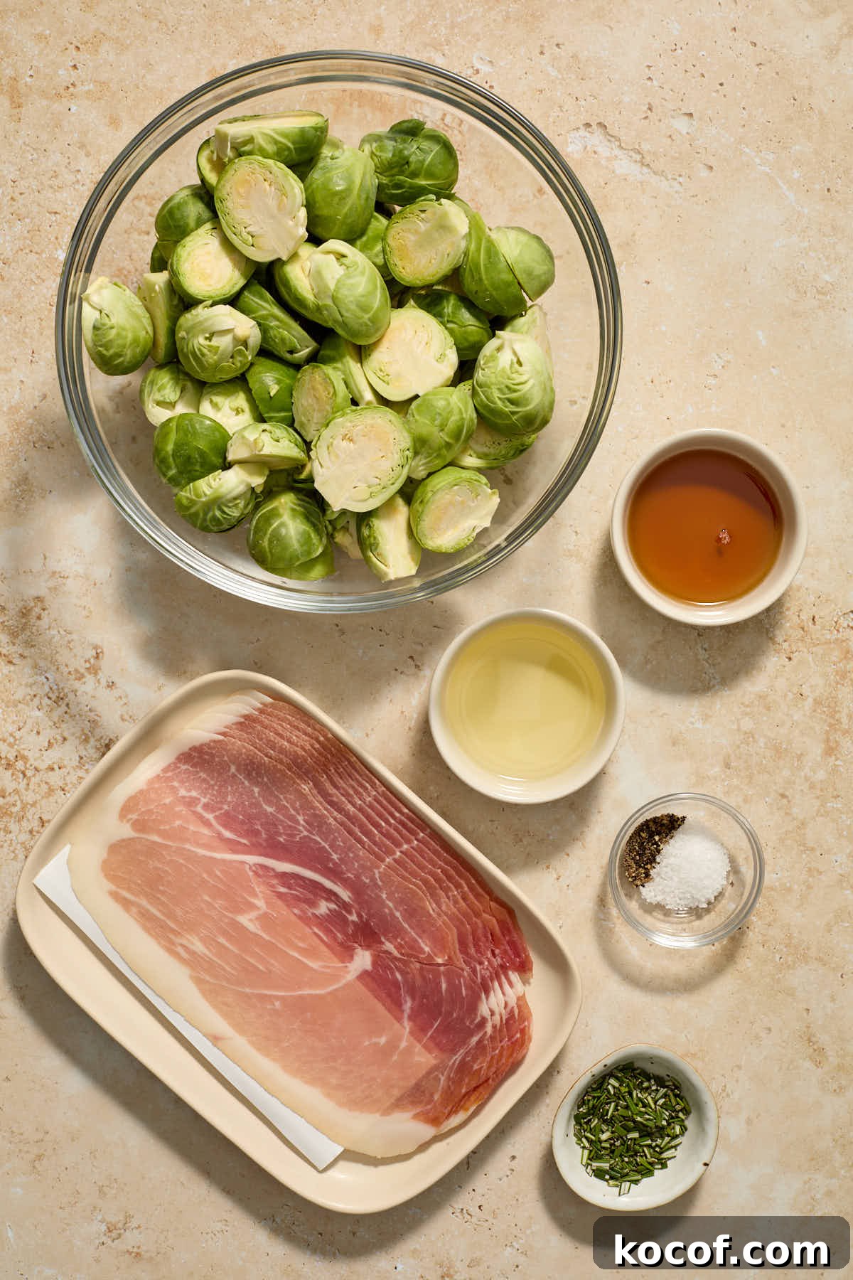 Ingredients to make roasted Brussels sprouts with prosciutto arranged in individual dishes.