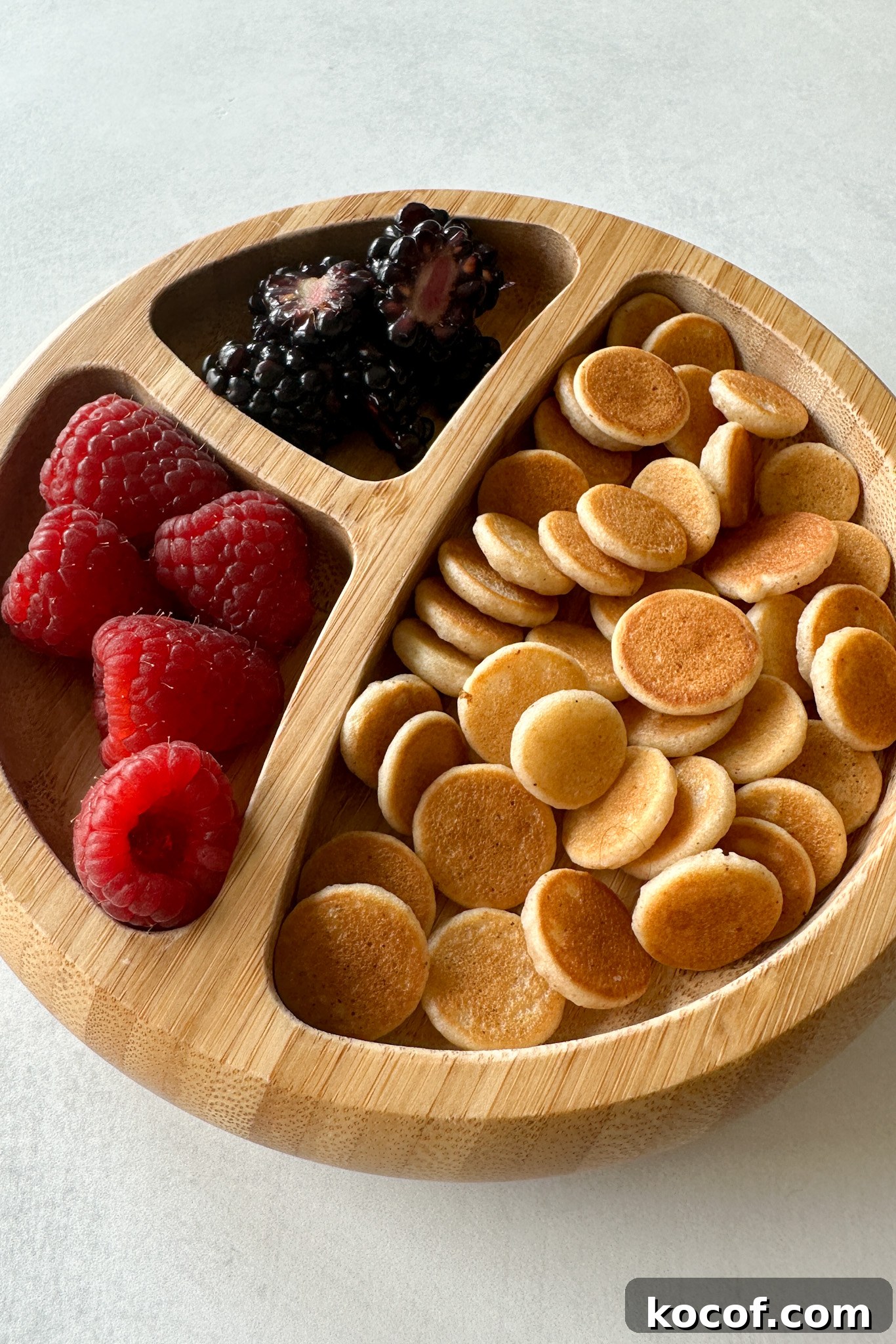 Egg free pancake cereal served with fruits.