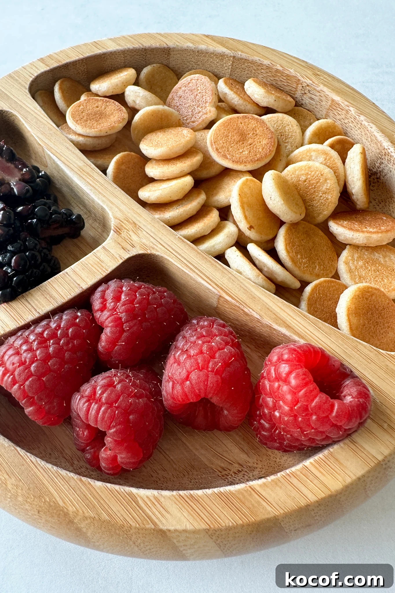 Egg free pancake cereal served with fruits.