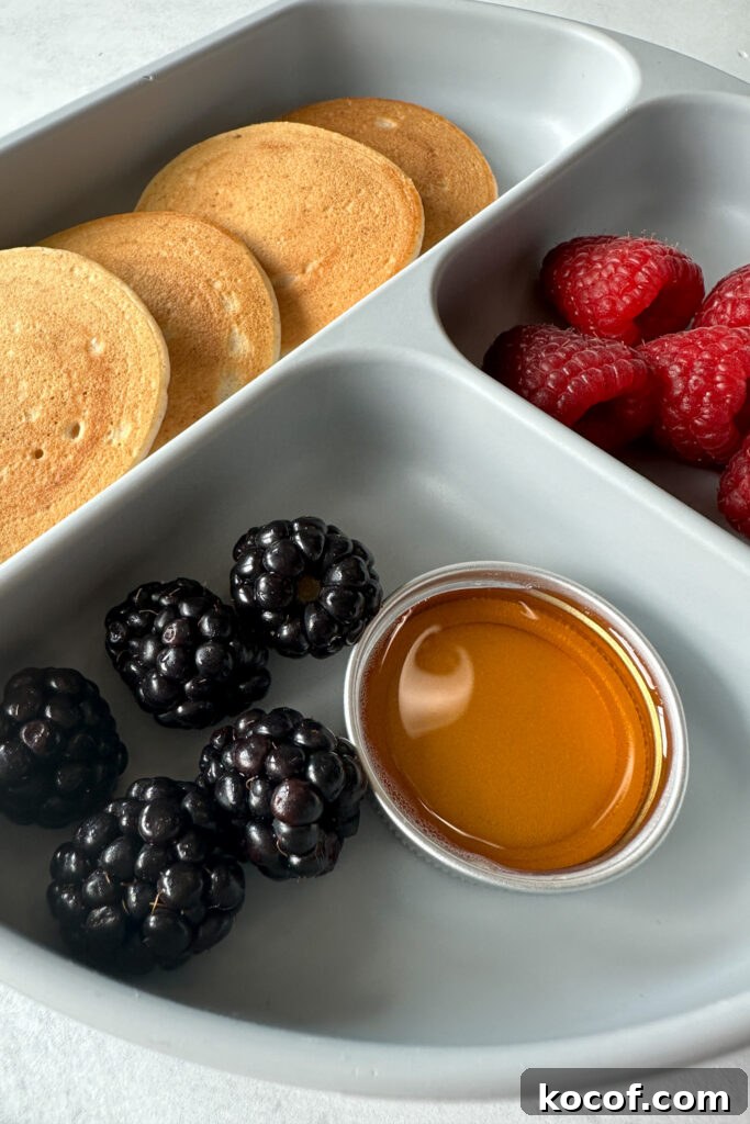 Egg free pancakes served with fruits.