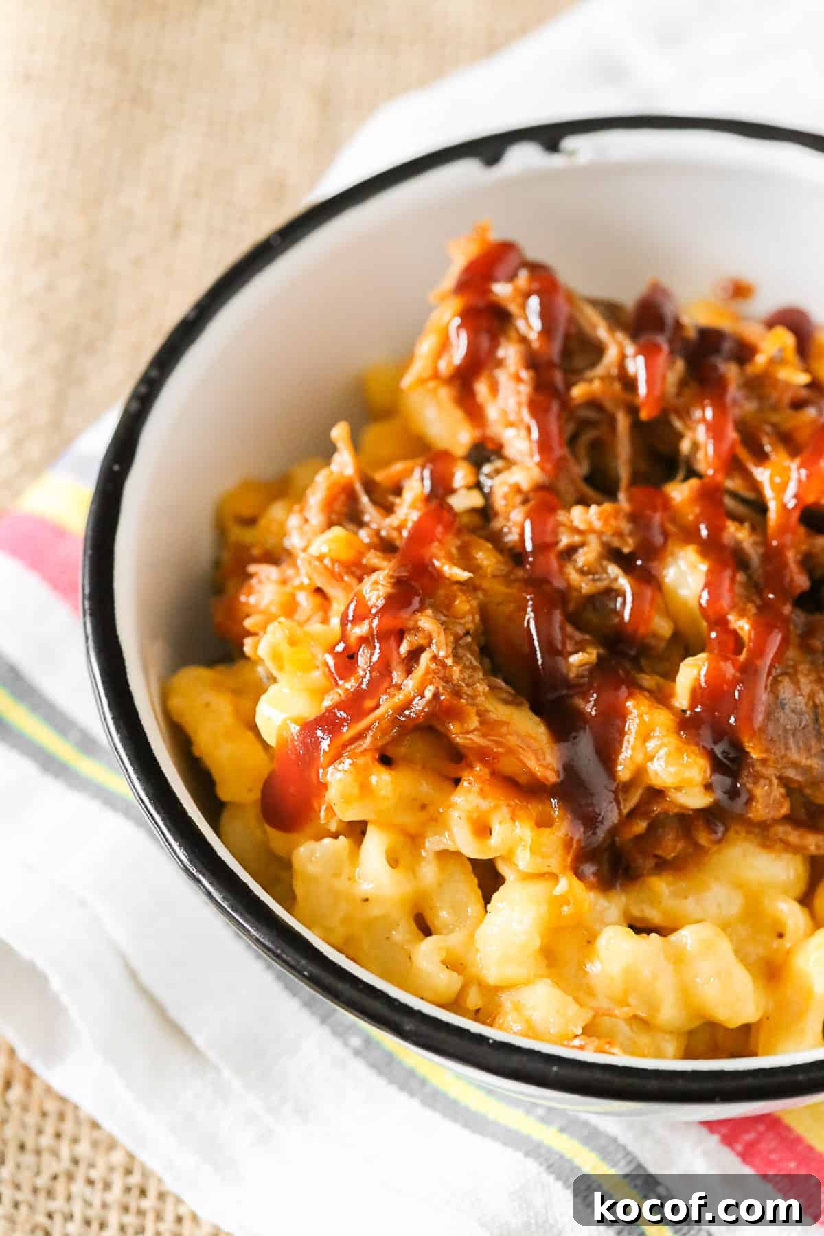 pulled pork mac and cheese scooped into a bowl