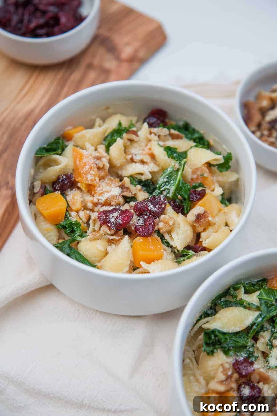 Creamy Roasted Butternut Squash Pasta with Sage and Parmesan 2 Celebrate this season by sharing this Creamy Butternut Squash Kale Pasta with friends and family! This pasta is surprisingly light but packed with winter flavors like fresh butternut squash, kale, cranberries and chopped walnuts. This is a pasta dish that is perfect to share and sure to impress!