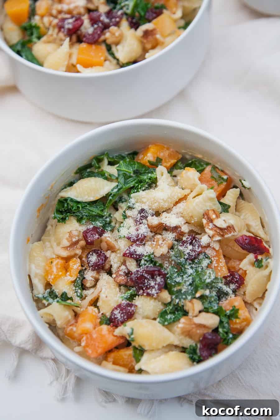 Creamy Roasted Butternut Squash Pasta with Sage and Parmesan 4 Celebrate this season by sharing this Creamy Butternut Squash Kale Pasta with friends and family! This pasta is surprisingly light but packed with winter flavors like fresh butternut squash, kale, cranberries and chopped walnuts. This is a pasta dish that is perfect to share and sure to impress!