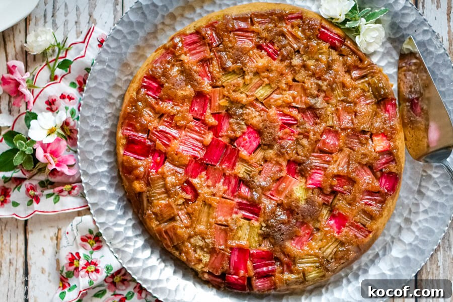 Rhubarb and Ginger Upside-Down Cake Recipe 8 Rhubarb Ginger Upside Down Cake on a silver serving platter.