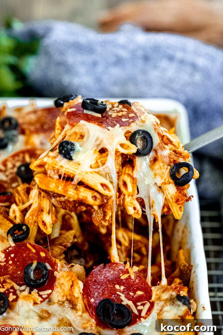 scooping pizza pasta casserole