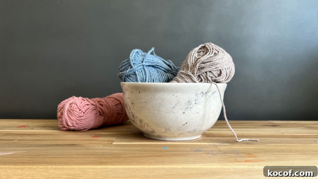 Create a Faux Marble Bowl: Step-by-Step DIY Tutorial 8 Faux marble bowl filled with yarn