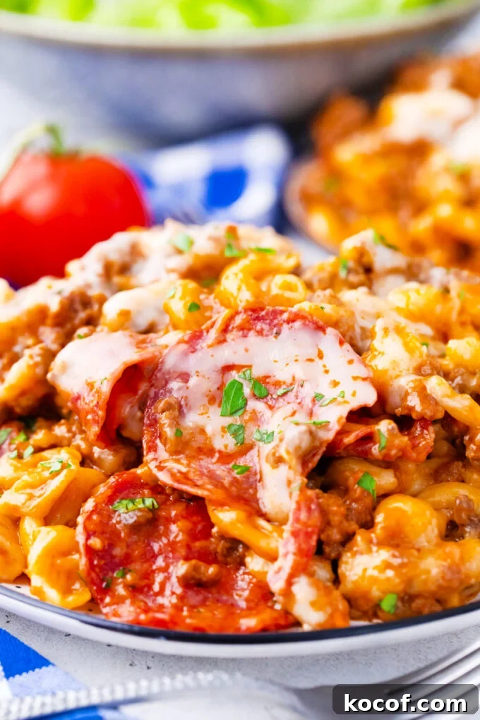 A plate of instant pot pizza pasta with pepperoni.