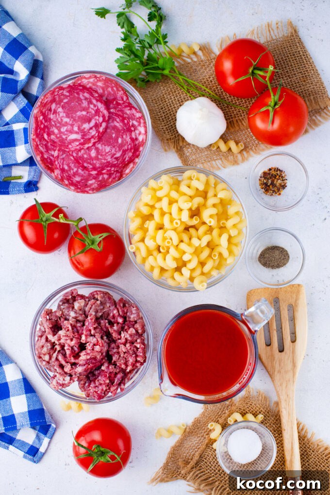 Overhead shot of instant pot pizza pasta ingredients in bowls on a table.
