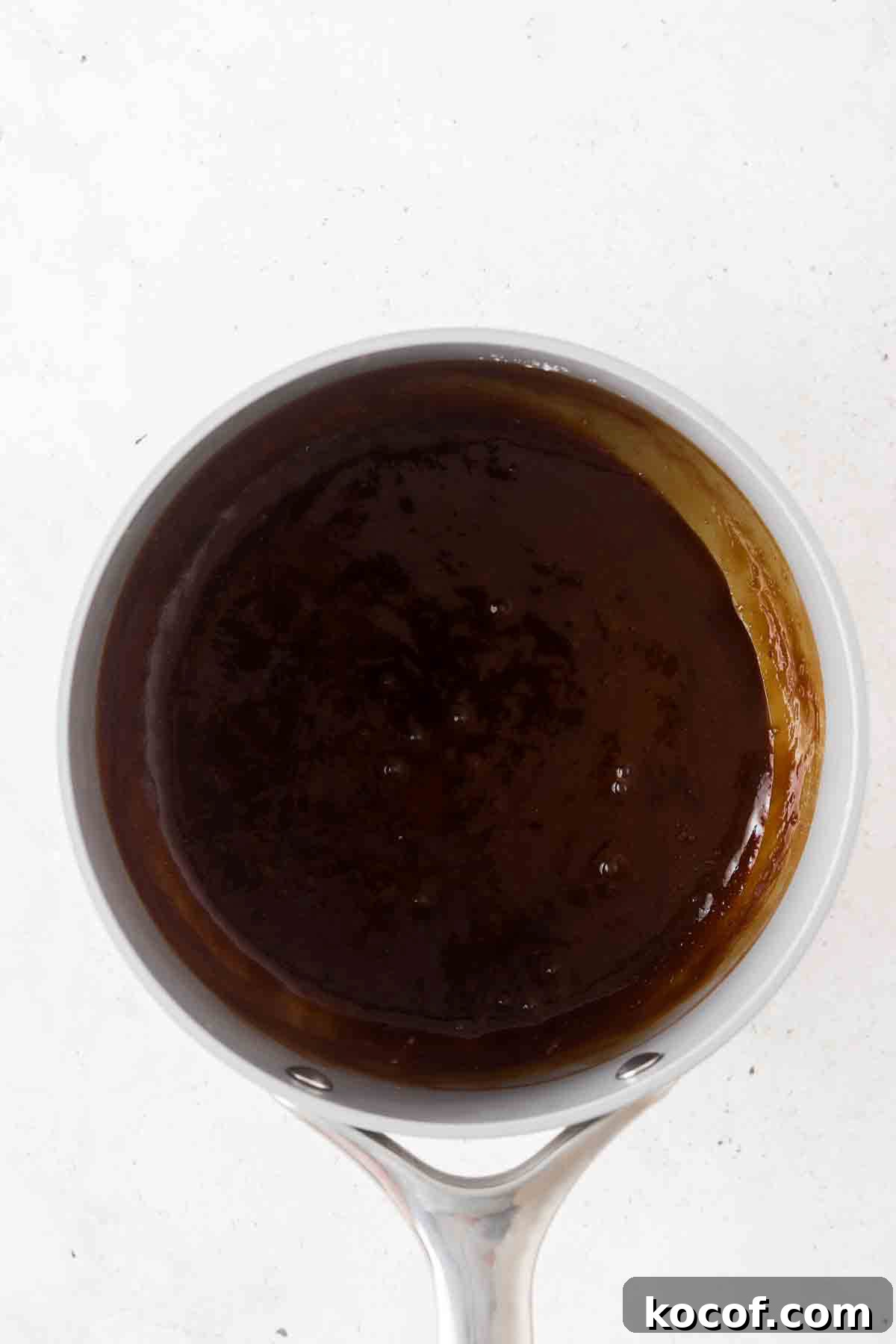 Creamy Vegan Caramel Sauce Recipe for Desserts and Toppings 2 Dairy free caramel sauce in a saucepan.