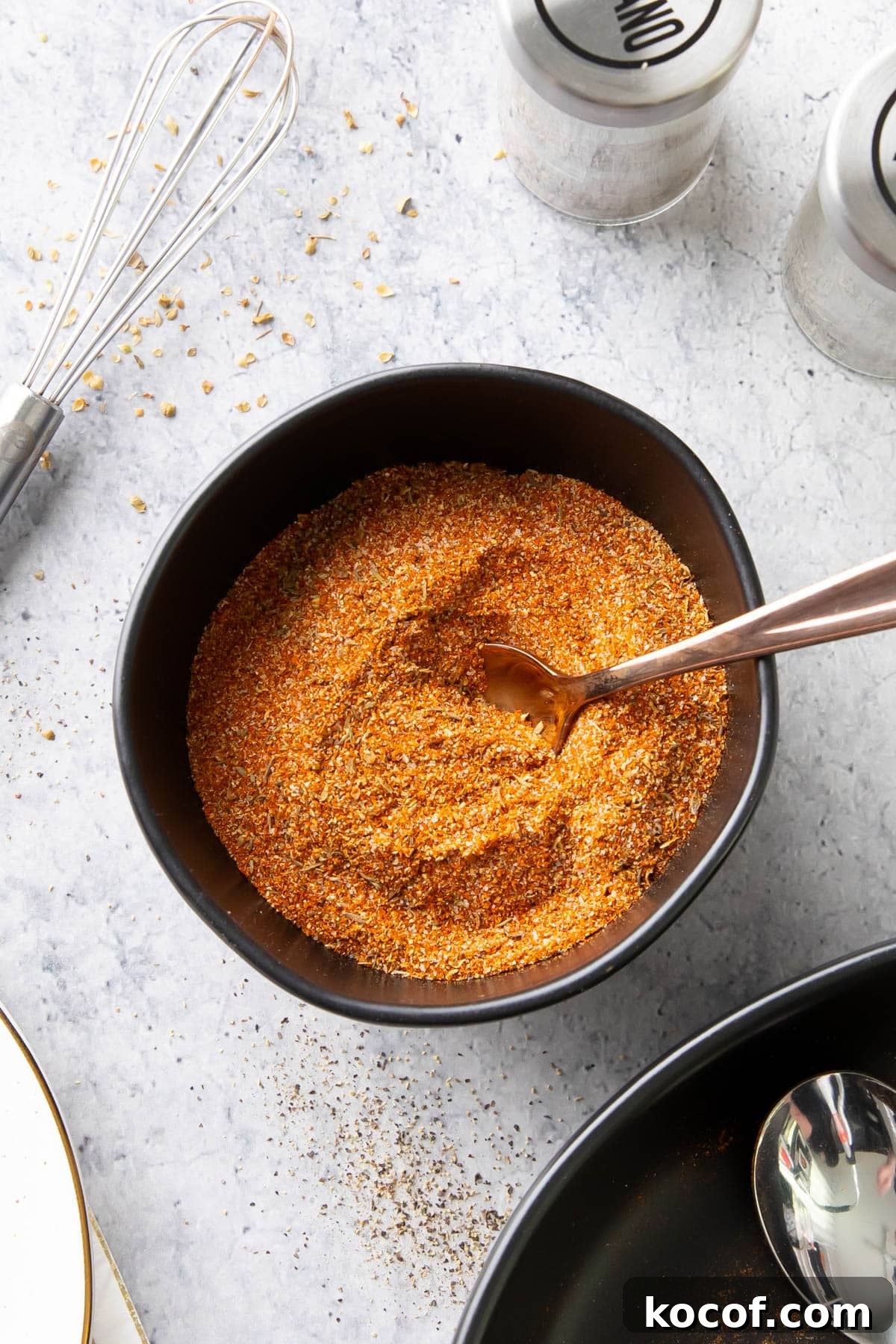 This spicy, flavorful Cajun Seasoning originating from Louisiana served in a bowl with a spoon.