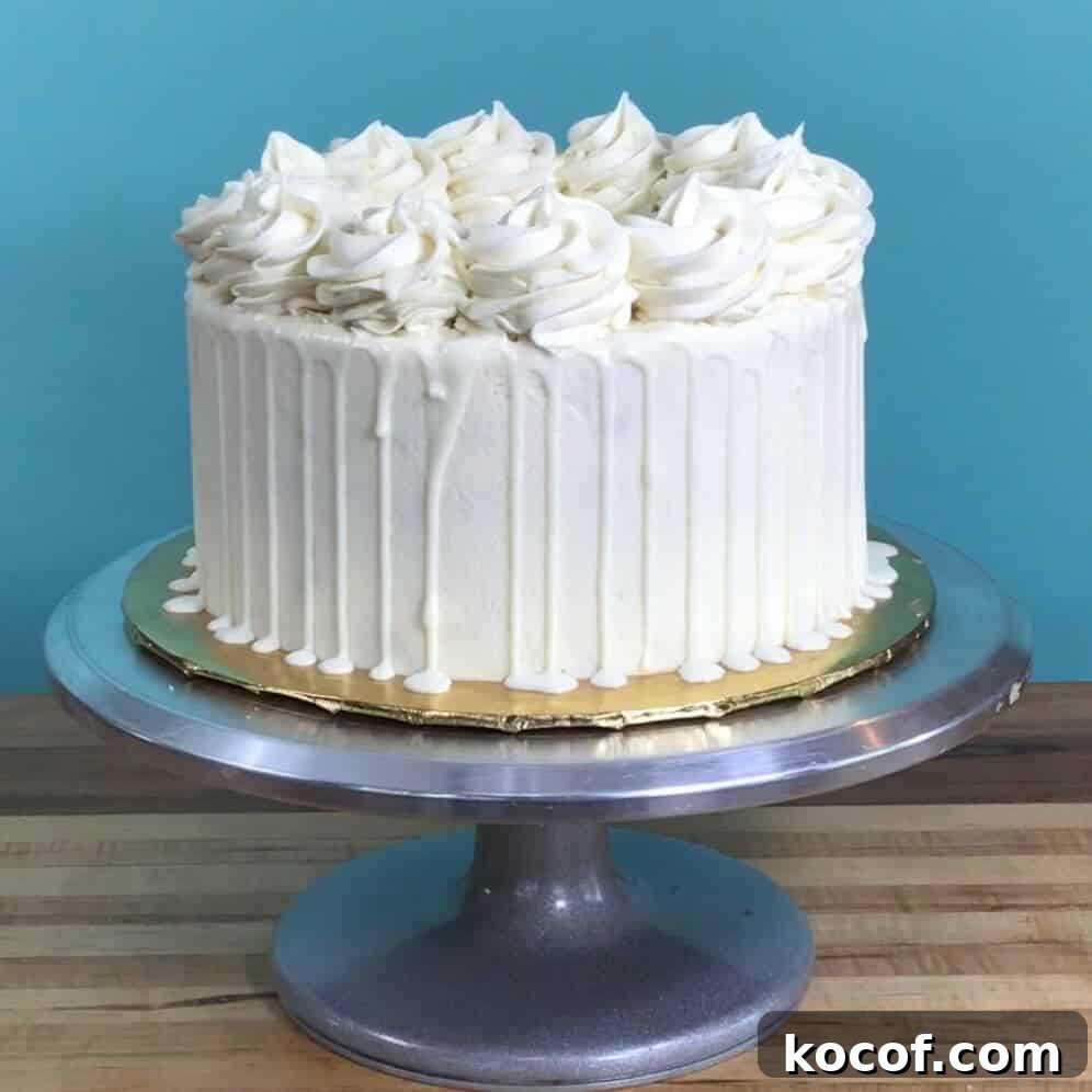 White Chocolate Ganache Drip Recipe and Step-by-Step Guide 7 Drizzling white chocolate ganache