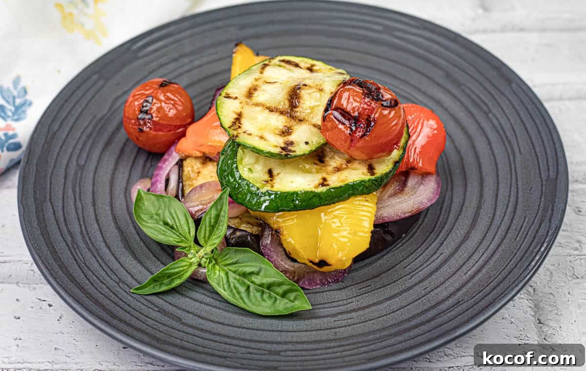 39 Outdoor Grilling Dinners That Make You Ditch the Oven Tonight 13 Close-up shot of Grilled Ratatouille on a black plate.