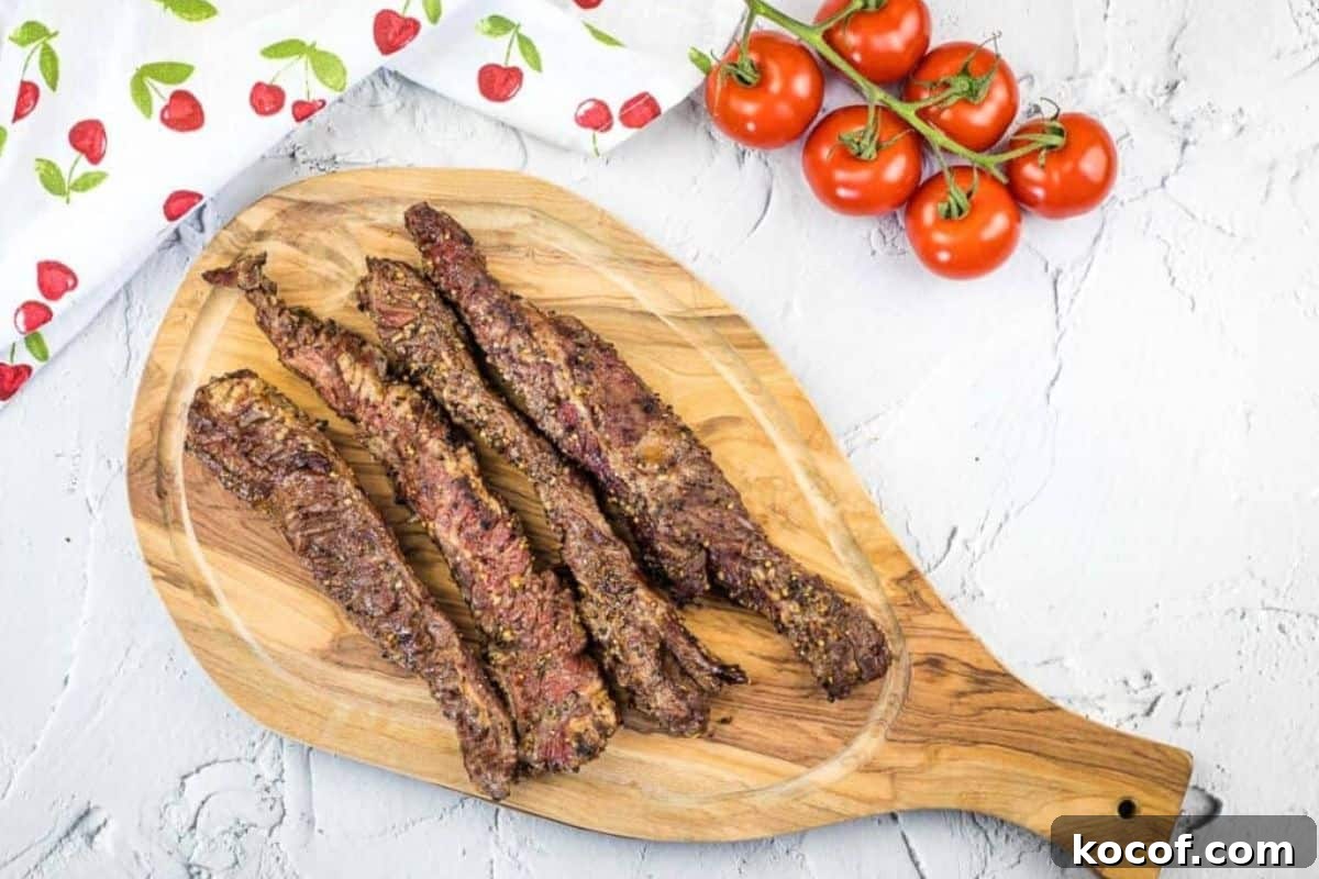 39 Outdoor Grilling Dinners That Make You Ditch the Oven Tonight 9 Grilled Beef Finger Meat on a wooden cutting board.