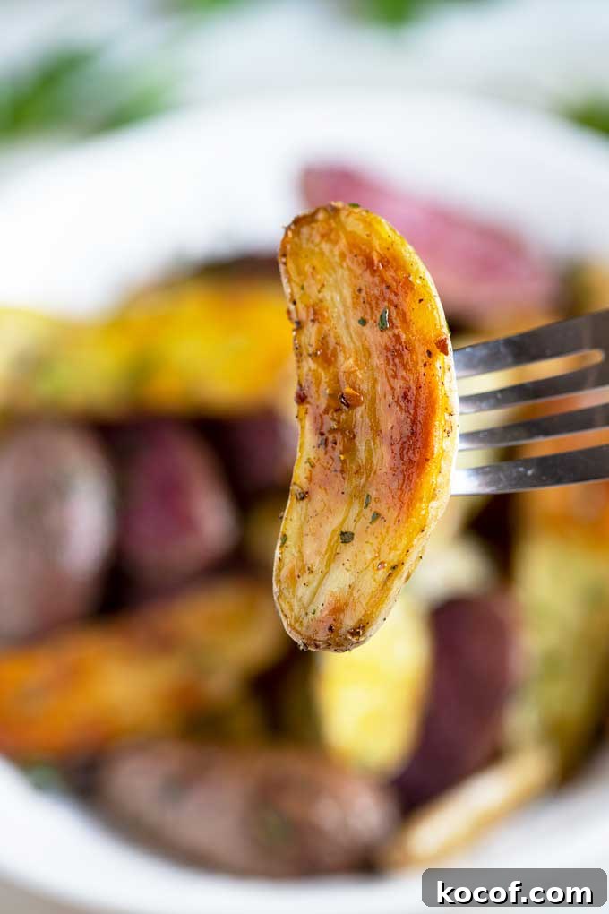 Crispy Roasted Fingerling Potatoes with Garlic and Herbs 3 Close up of a single crispy potato