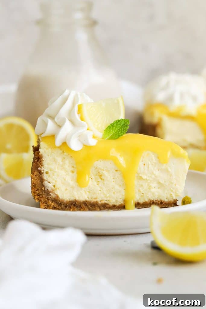 Gluten-Free Strawberry Cheesecake Recipe with Fresh Berry Topping 9 a slice of gluten-free lemon cheesecake with homemade lemon curd