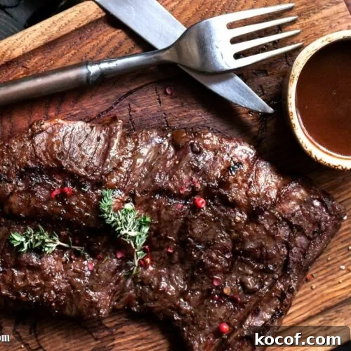 steak on serving board with homemade a1 steak sauce