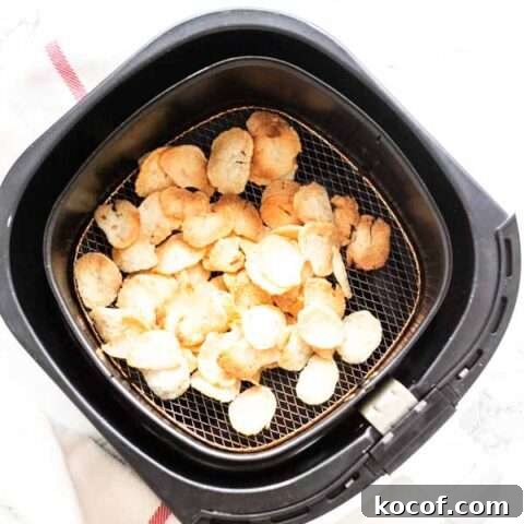 Prawn crackers puffed up in an Air Fryer basket