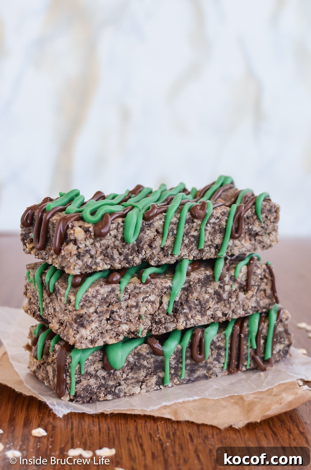 Mint Almond Granola Bars Recipe – Refreshing No-Bake Snack 4 Three chocolate granola bars stacked together.