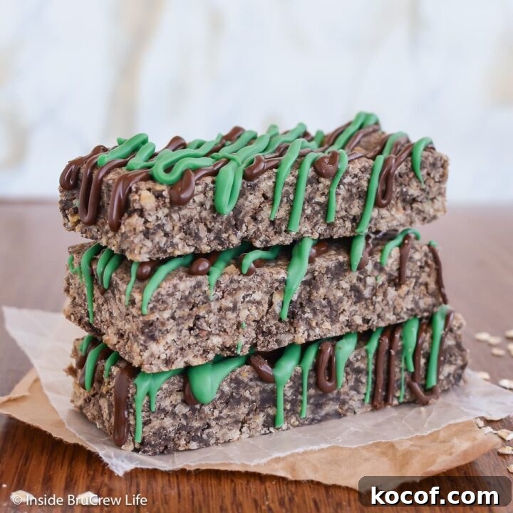 Three chocolate granola bars stacked together.
