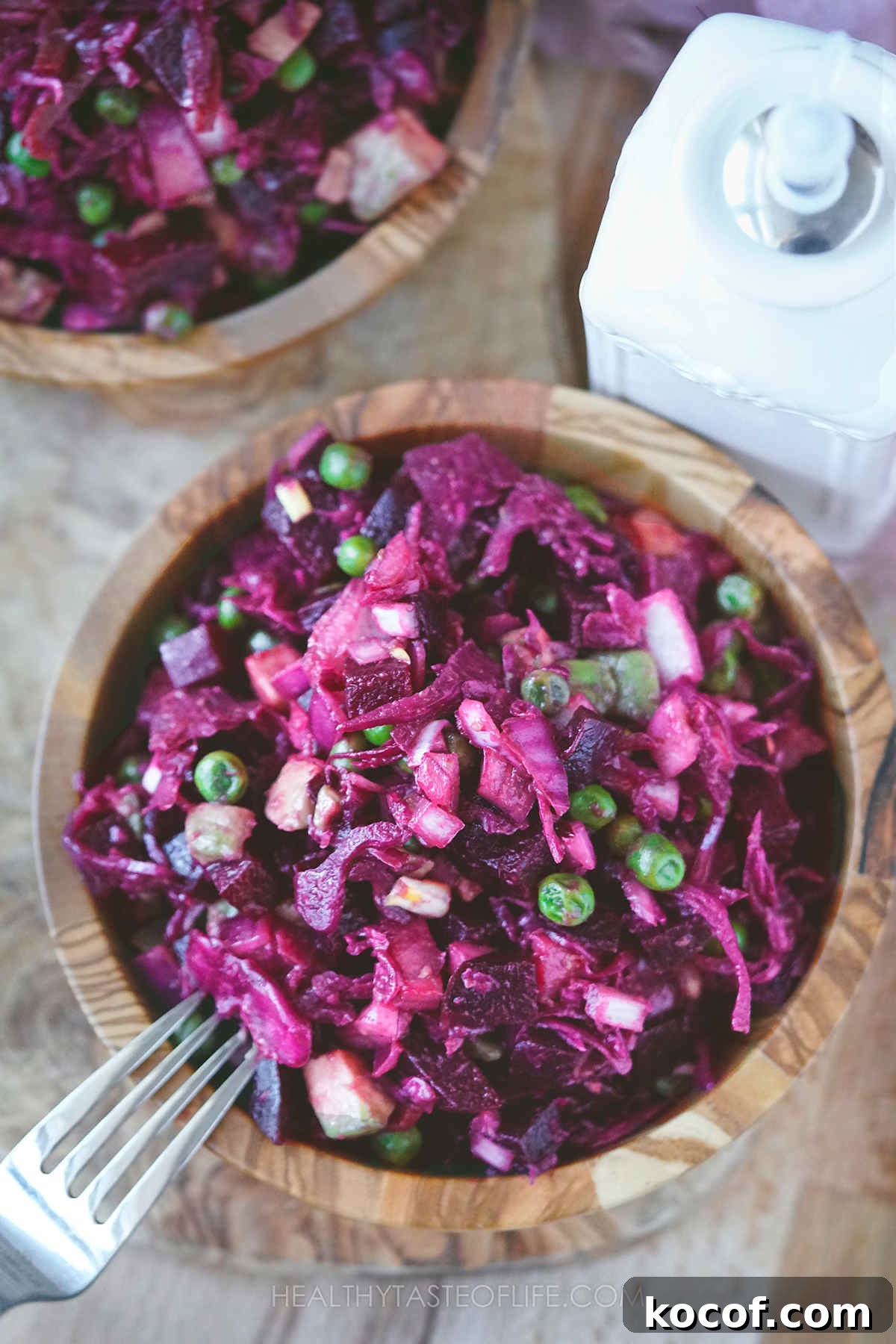 Russian Vinaigrette Salad with Beets and Sauerkraut 7 Over head shot of Russian beet salad served in a small wooden bowl.
