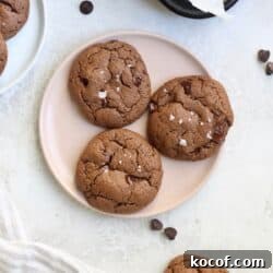 pink plate of three chocolate cookies