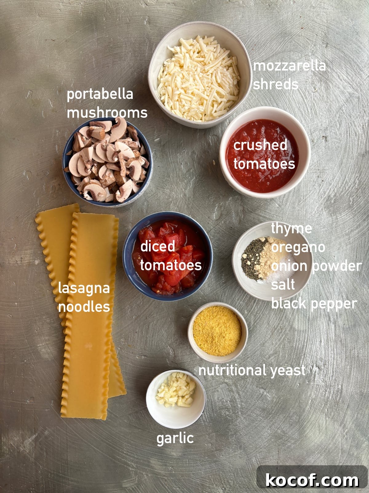 overhead image of ingredients needed to make lasagna soup. Ingredients are in small bowls and labeled with white text