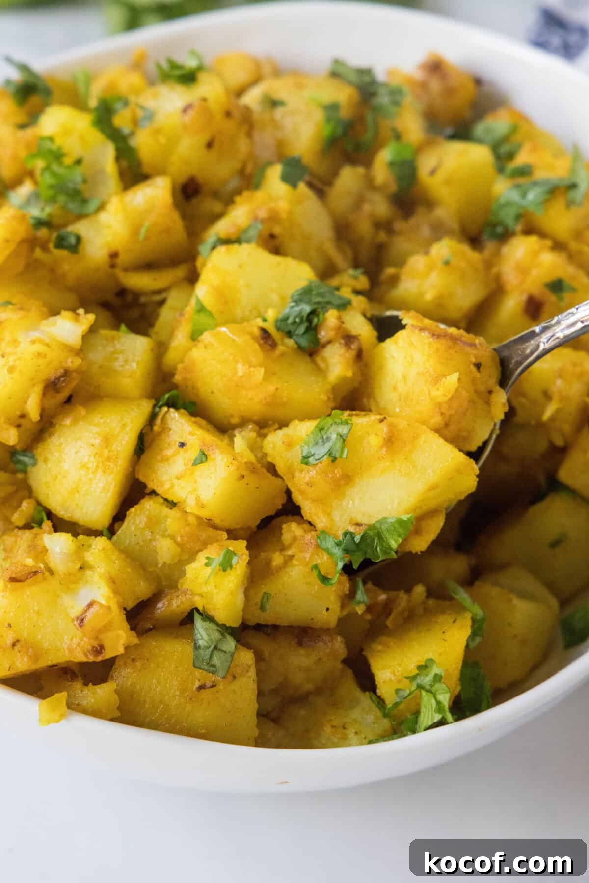 scooping potatoes out of serving dish
