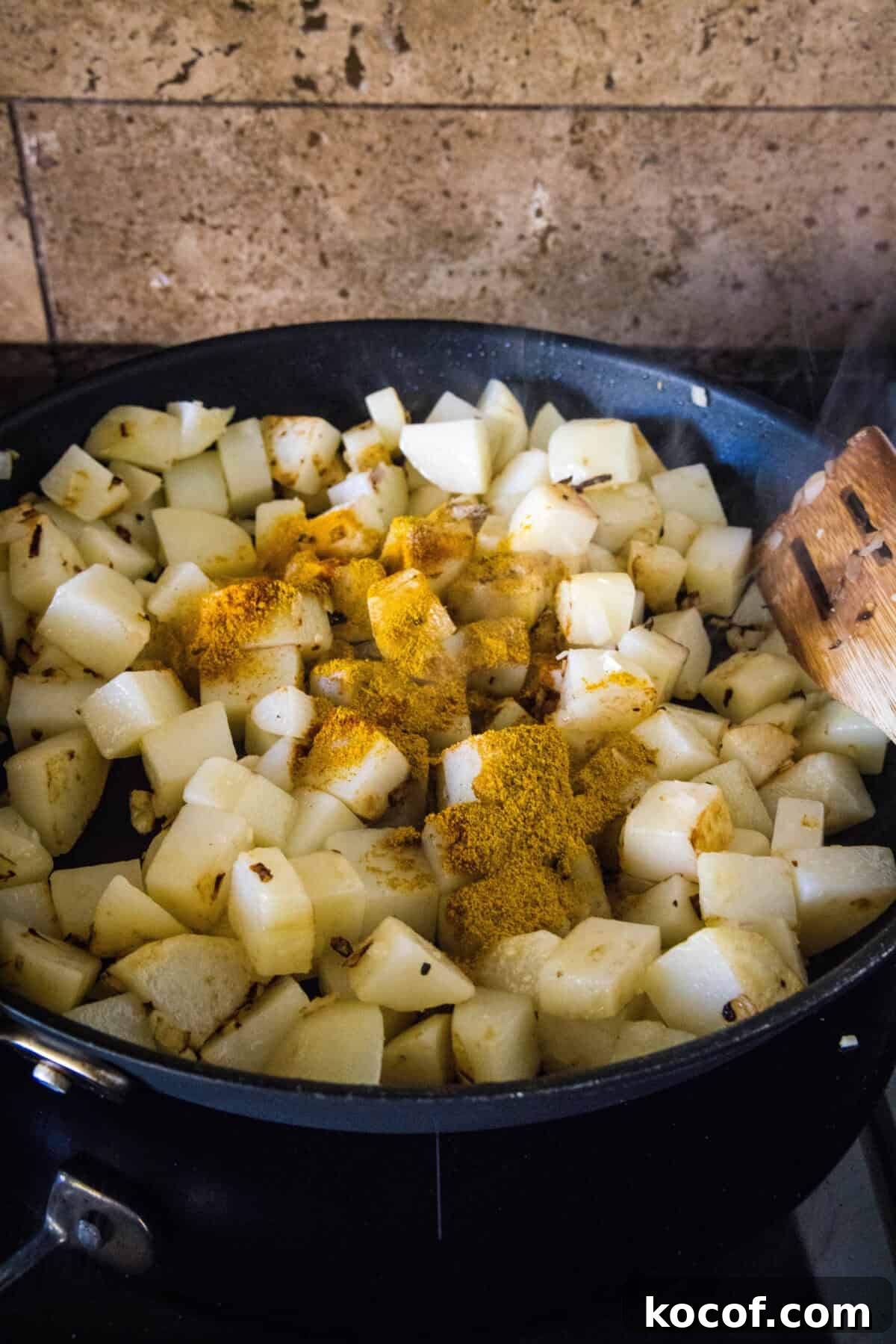 potatoes in a skillet topped with spices