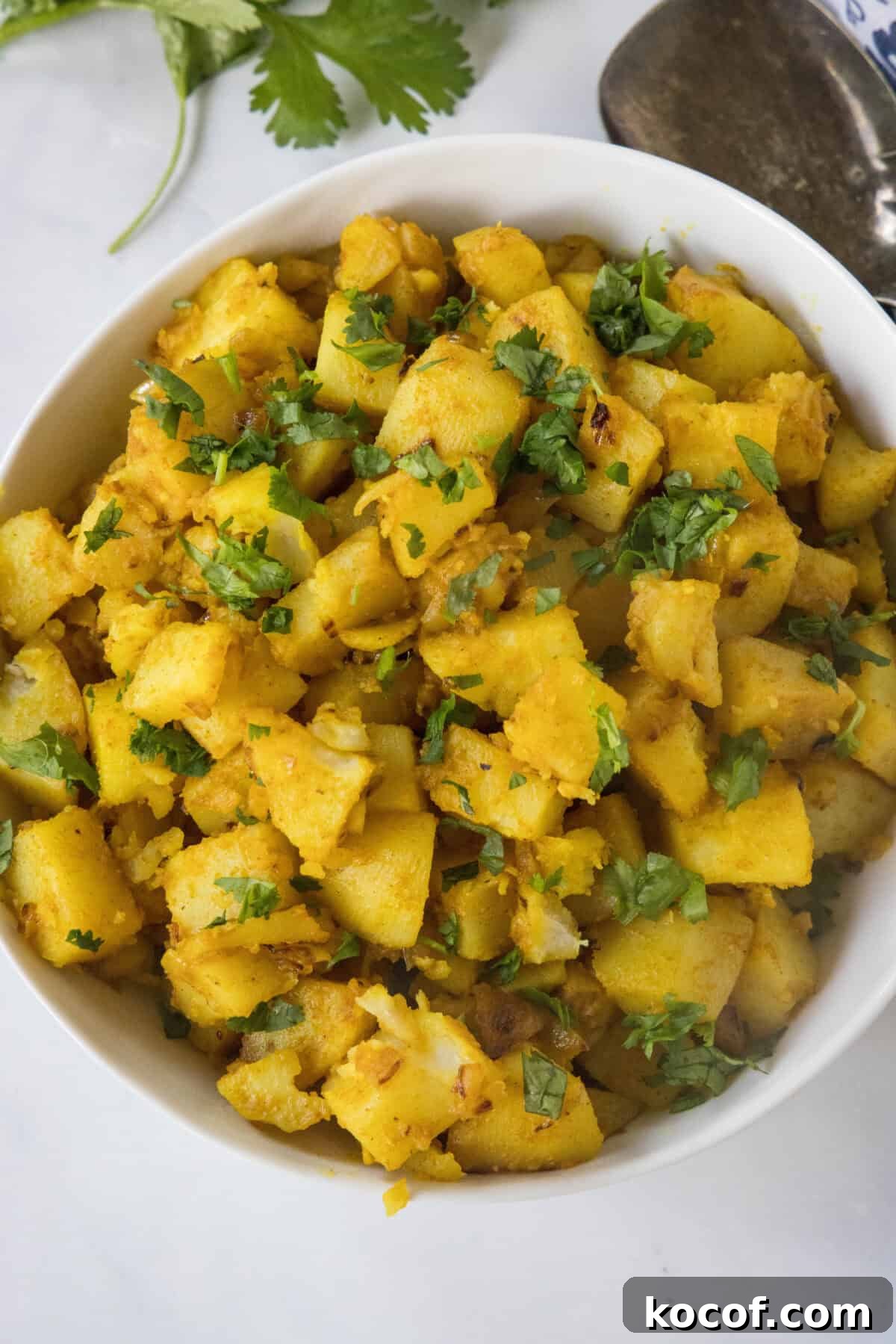 looking down on bowl of curried potatoes