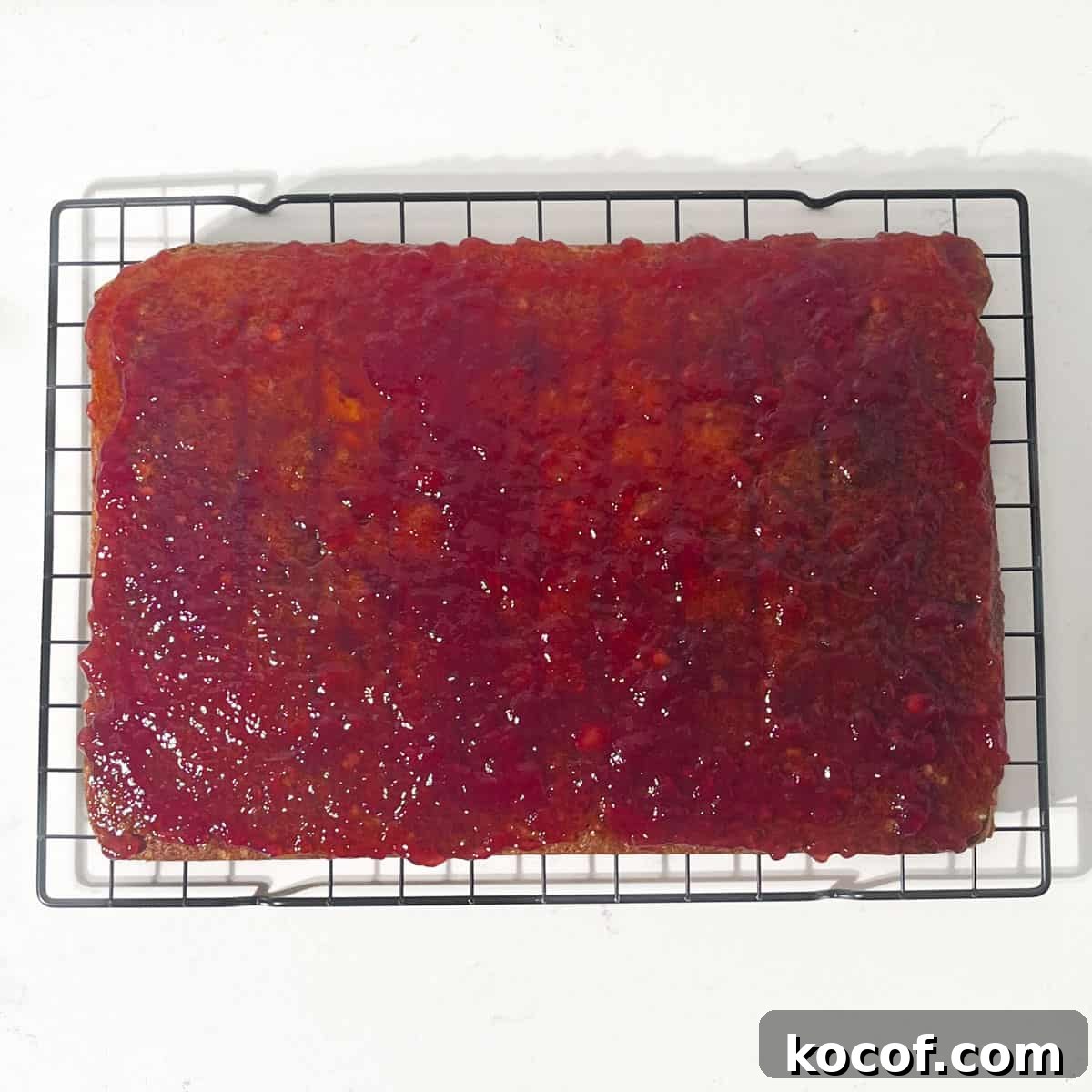 The sponge with a layer of raspberry jam.