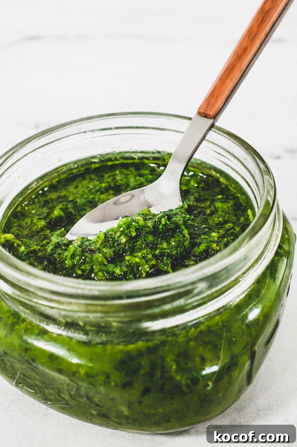 A small mason jar holds a green salsa from Georgia called Ajika
