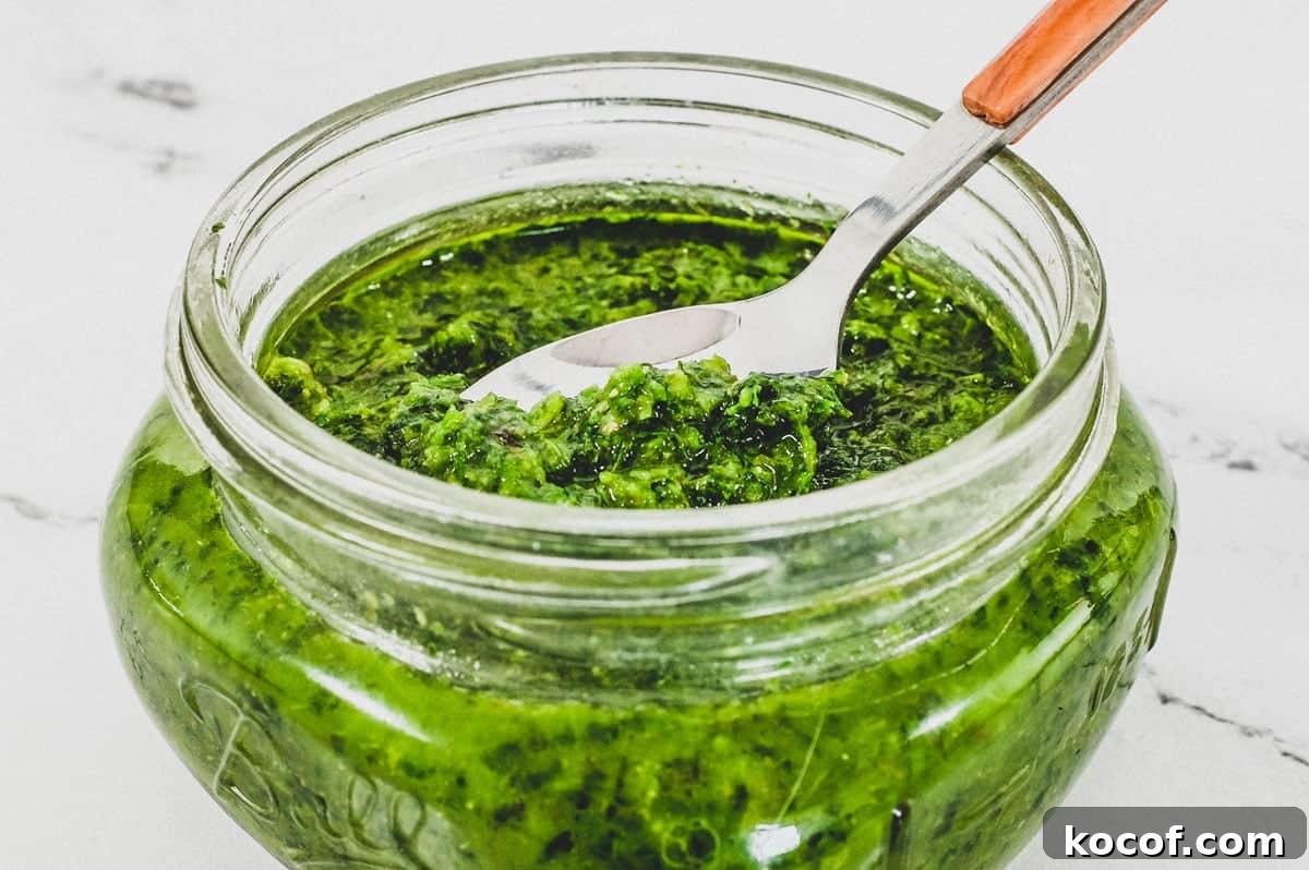 A small mason jar holds a green salsa from Georgia called Ajika