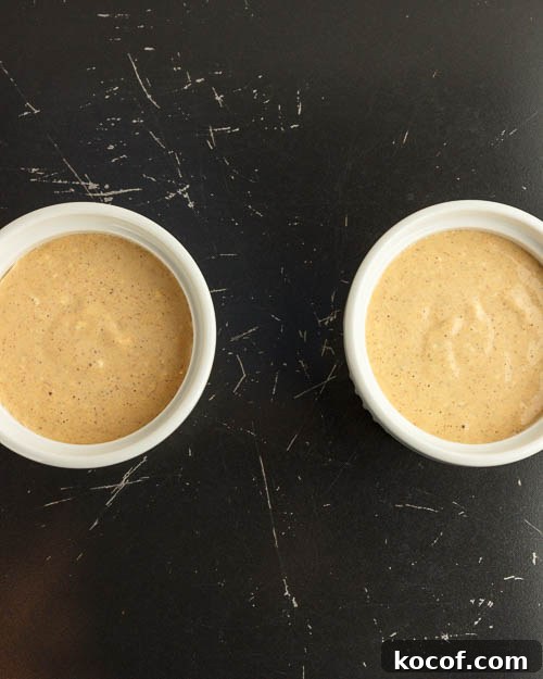 Pouring batter into the ramekins.