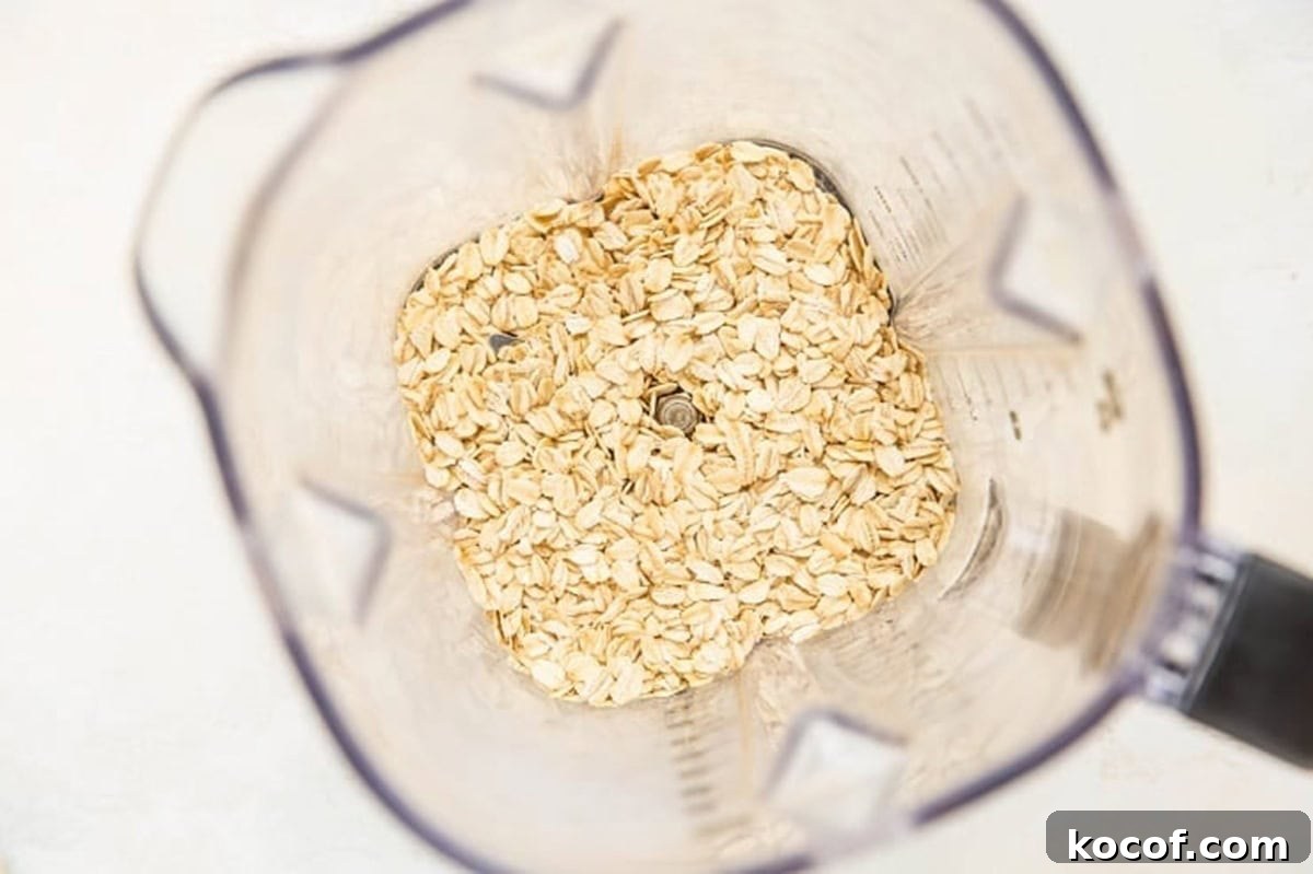Oats in a blender, ready to be blended into a flour to make a recipe.